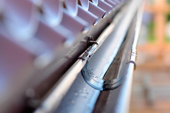 A close-up shot of a roof gutter